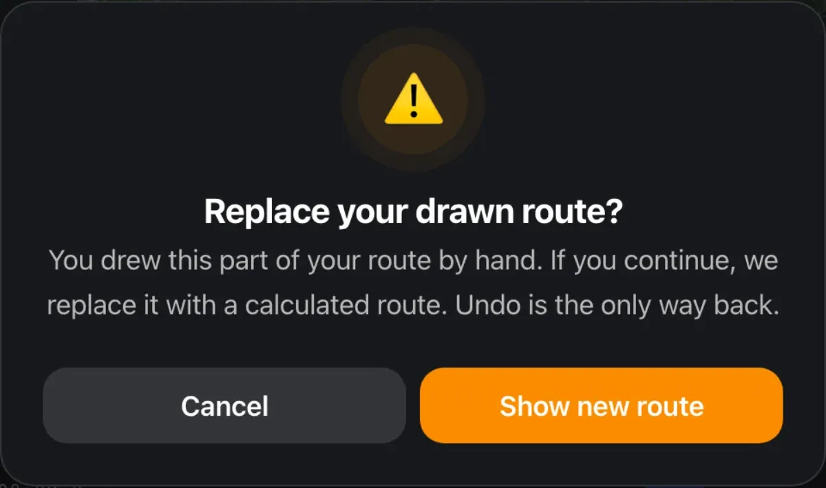 A warning dialog asking whether to replace a drawn route, with Cancel and Show new route